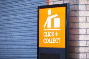 Differences between e-commerce and physical stores. There is a signboard stating click + collect.